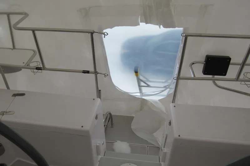 Slide: The Image of Interior view of a 2019 Catalina 425 sailboat cockpit with protective covering. - 16