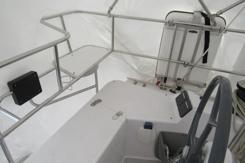 Slide: The Image of Interior view of a 2019 Catalina 425 sailboat cockpit with steering wheel and controls. - 17