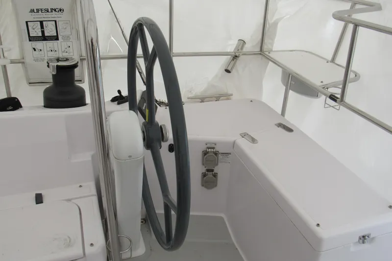 Slide: The Image of Steering wheel of a 2019 Catalina 425 sailboat cockpit, featuring modern controls. - 18