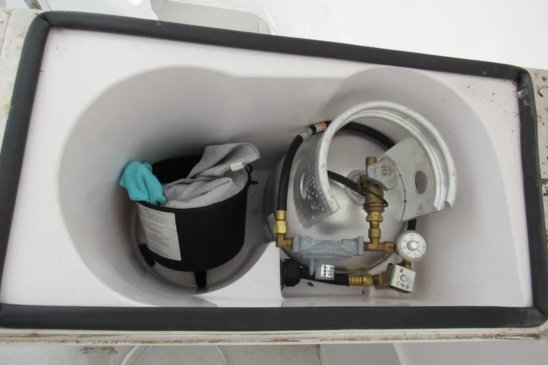 Slide: The Image of Storage compartment on a 2019 Catalina 425 yacht with propane tank and cleaning supplies. - 19