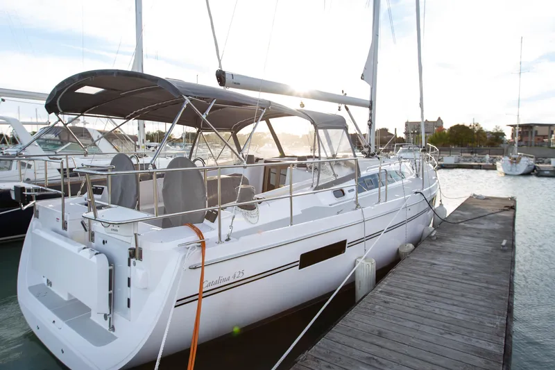Slide: The Image of 2019 Catalina 425 sailboat covered in snow, supported on stands in a winter setting. - 2
