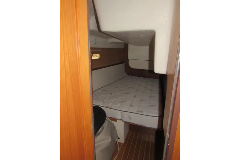Slide: The Image of Interior cabin of 2019 Catalina 425 sailboat with mattress and wooden finish. - 25