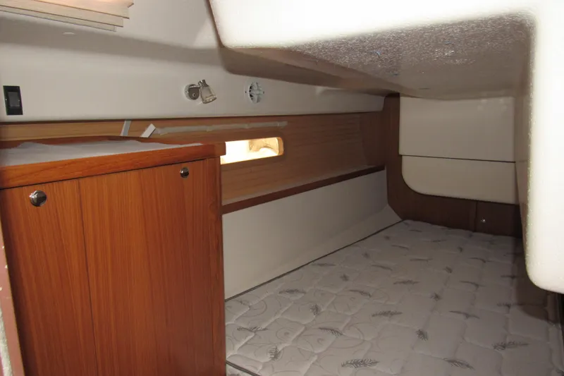 Slide: The Image of 2019 Catalina 425 interior cabin with wooden cabinetry and cozy sleeping area. - 26