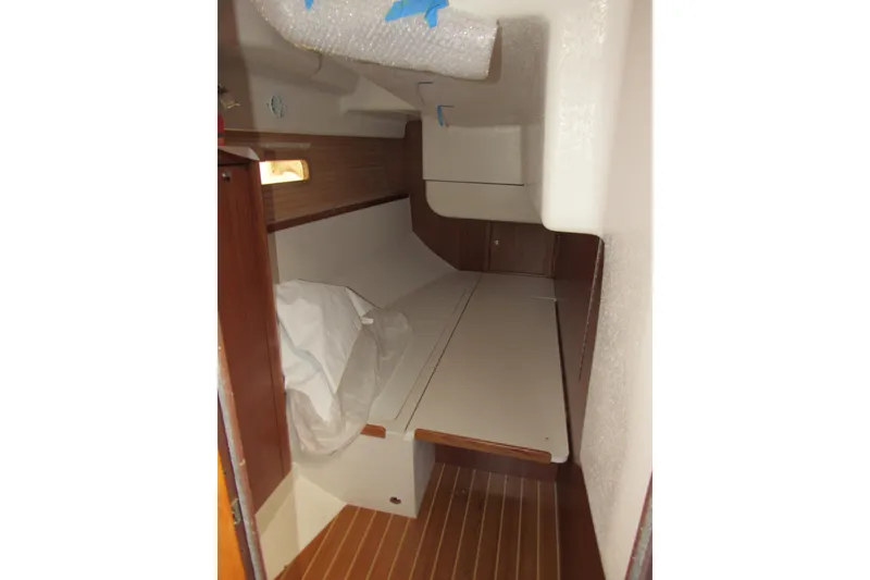 Slide: The Image of 2019 Catalina 425 interior cabin with wooden accents and compact design. - 27
