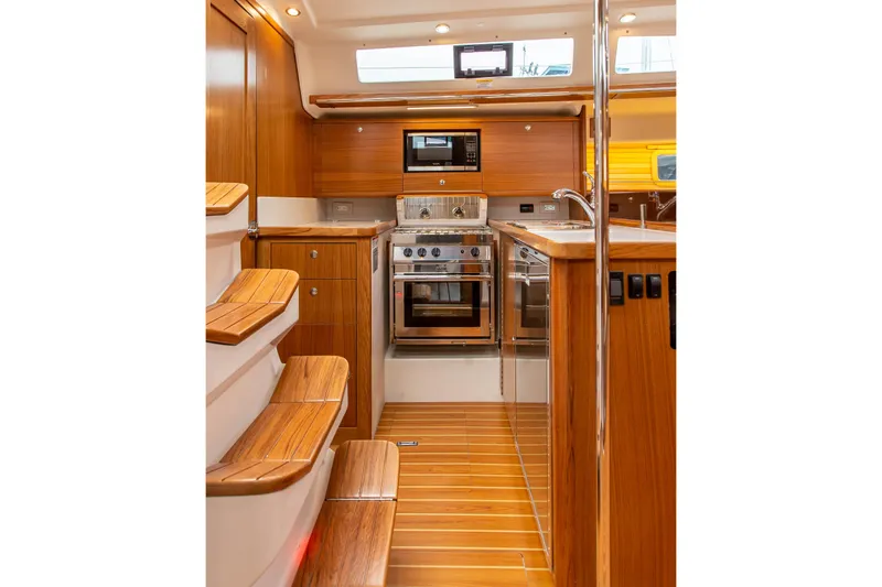 Slide: The Image of 2019 Catalina 425 sailboat in winter storage, covered and supported on stands. - 3