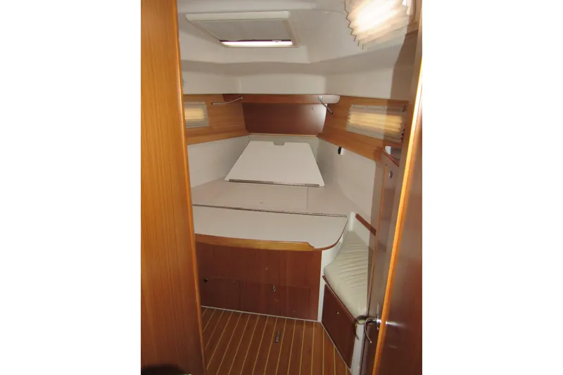 Slide: The Image of 2019 Catalina 425 interior cabin with wooden finish and cozy sleeping area. - 33