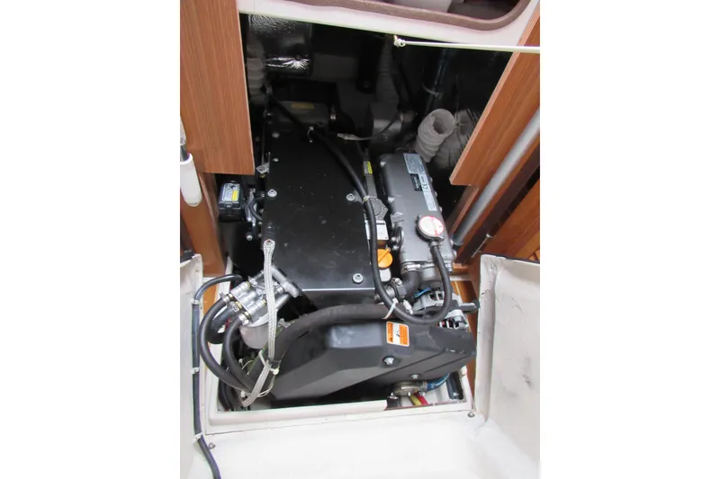 Slide: The Image of Engine compartment of a 2019 Catalina 425 sailboat, showcasing mechanical components. - 37