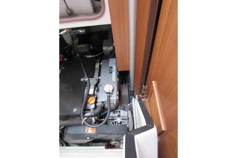 Slide: The Image of Engine compartment of a 2019 Catalina 425 sailboat, showcasing mechanical components. - 38