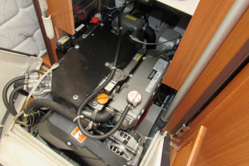 Slide: The Image of Engine compartment of a 2019 Catalina 425 sailboat, showcasing mechanical components. - 39