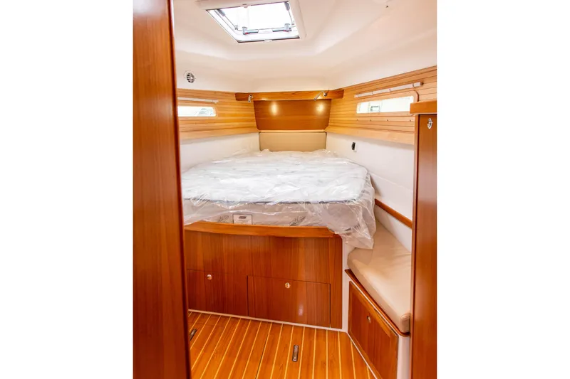 Slide: The Image of Luxurious cabin interior of 2019 Catalina 425 yacht with wooden finishes and skylight. - 45