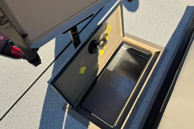 Slide: The Image of Open storage compartment on 2026 SeaArk Shadow 18 boat deck. - 10