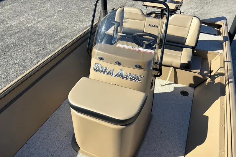 Slide: The Image of 2026 SeaArk Shadow 18 boat interior with steering console and seating. - 14