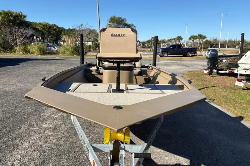 Slide: The Image of 2026 SeaArk Shadow 18 boat on trailer, parked outdoors on a sunny day. - 7