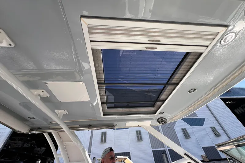 Slide: The Image of 2020 Chaparral 300 OSX boat interior roof with sunroof and speaker. - 5