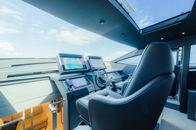 Slide: The Image of Luxurious interior of 2021 Pershing 8X yacht with modern seating and panoramic windows. - 11