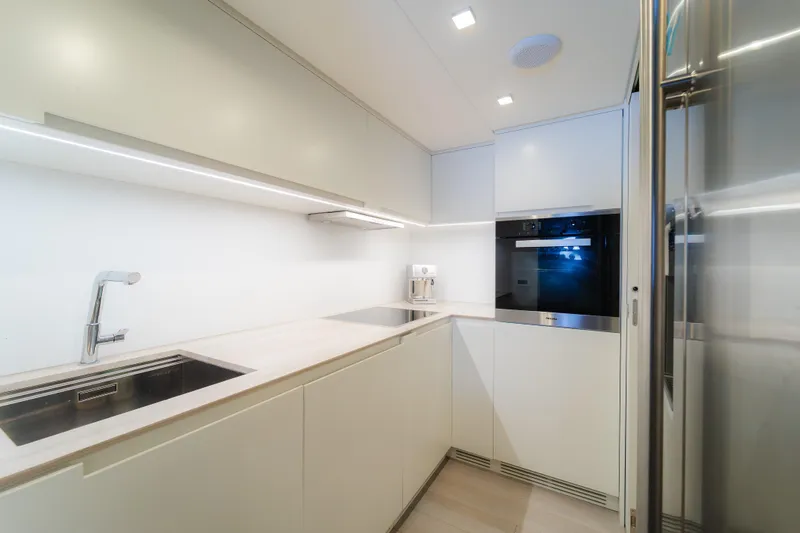 Slide: The Image of Modern interior of 2021 Pershing 8X yacht with sleek seating and wall-mounted TV. - 26