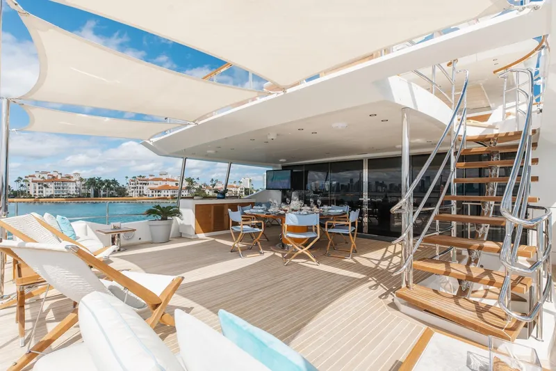 Slide: The Image of Luxurious 2018 Benetti Fast 125 yacht deck with elegant seating and ocean view. - 30