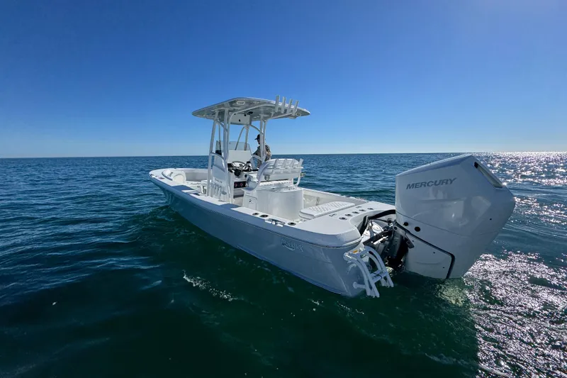 Slide: The Image of 2026 BlackJack 256 Coastal boat on open water, featuring a Mercury engine. - 11