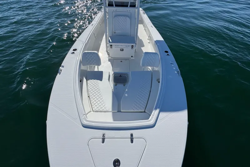 Slide: The Image of 2026 BlackJack 256 Coastal boat on water, featuring sleek white design and seating. - 15