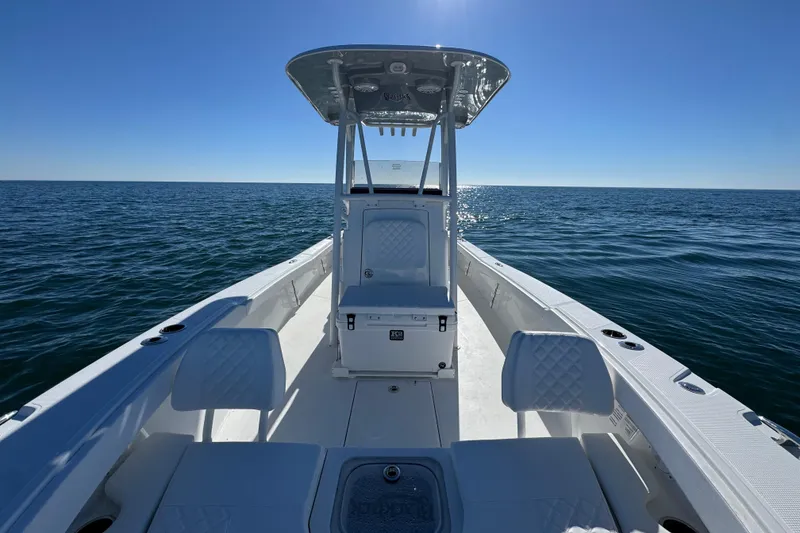 Slide: The Image of 2026 BlackJack 256 Coastal boat on open water under clear blue sky. - 17