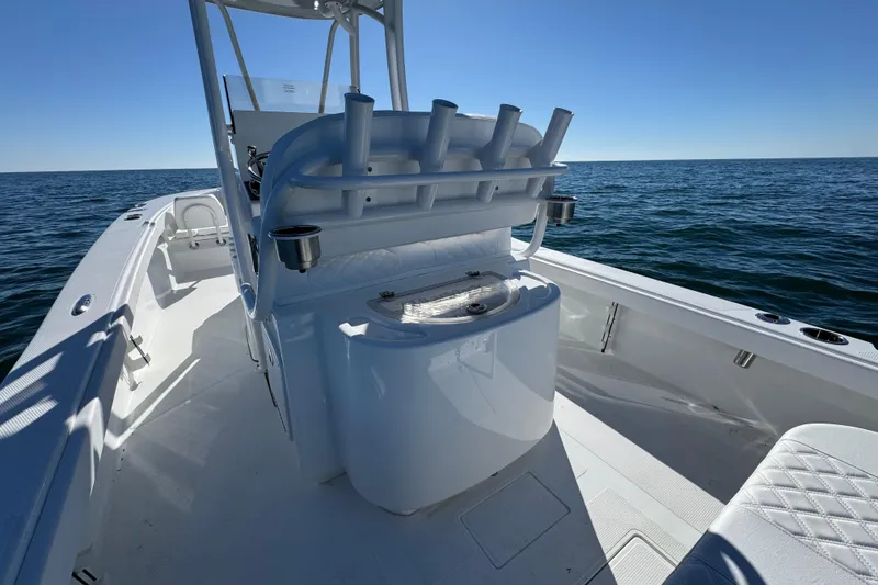 Slide: The Image of 2026 BlackJack 256 Coastal boat interior on open water, featuring sleek design and rod holders. - 28