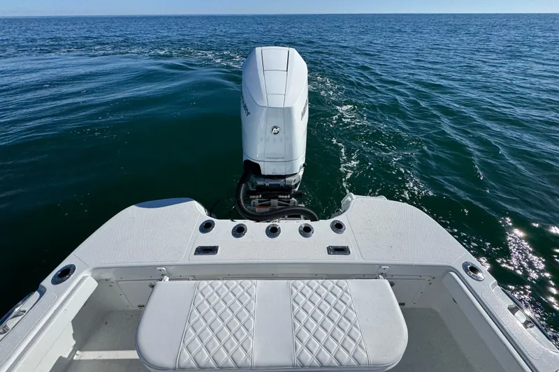 Slide: The Image of 2026 BlackJack 256 Coastal boat with outboard motor on open sea. - 32