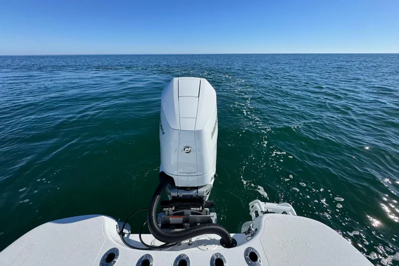 Slide: The Image of 2026 BlackJack 256 Coastal boat with outboard motor on open sea. - 34