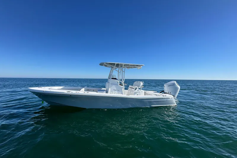 Slide: The Image of 2026 BlackJack 256 Coastal boat on open sea under clear blue sky. - 5