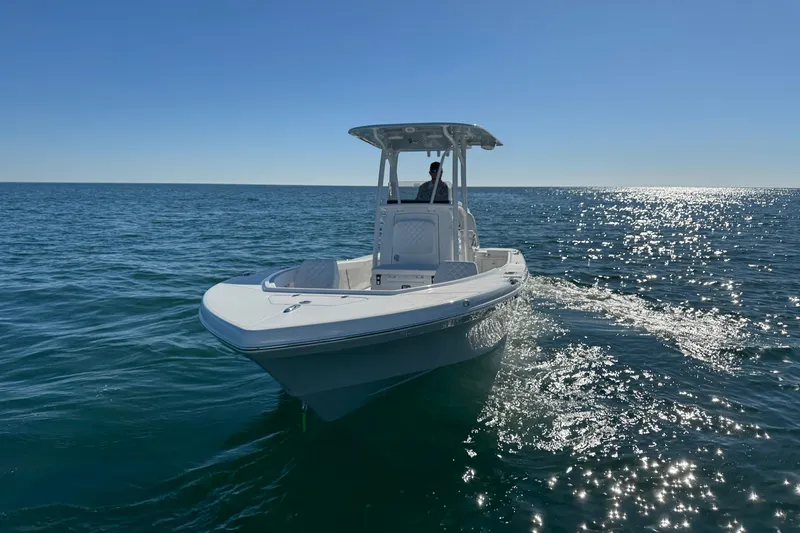 Slide: The Image of 2026 BlackJack 256 Coastal boat cruising on open water under clear blue sky. - 7