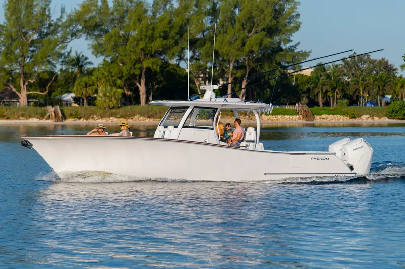 Slide: The Image of Phenom 34 Center Console boat 2026 cruising on calm waters. - 3
