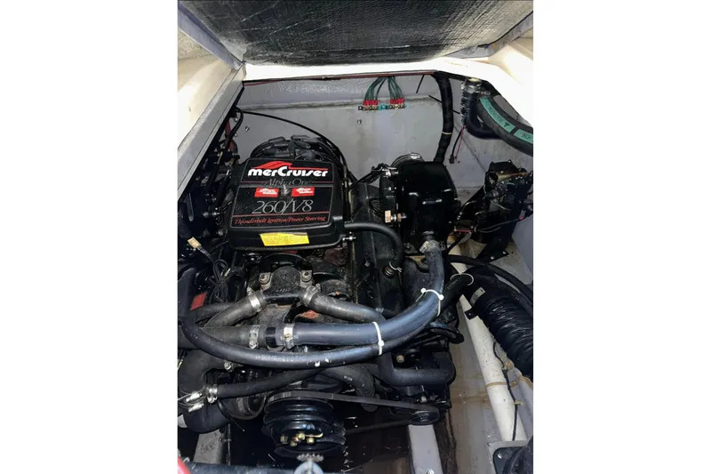 Slide: The Image of Engine compartment of 1986 Sea-Ray 340 Express with MerCruiser 260 V8 engine. - 12