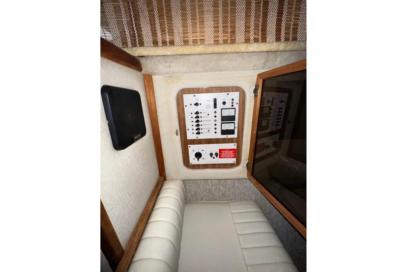 Slide: The Image of 1986 Sea-Ray 340 Express cabin interior with control panel and speaker. - 13