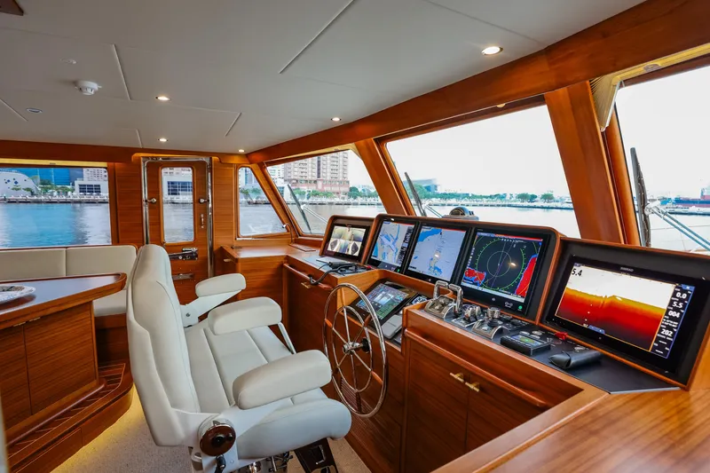 Slide: The Image of Luxurious 2027 Fleming 85 Pilothouse yacht interior with advanced navigation systems. - 23