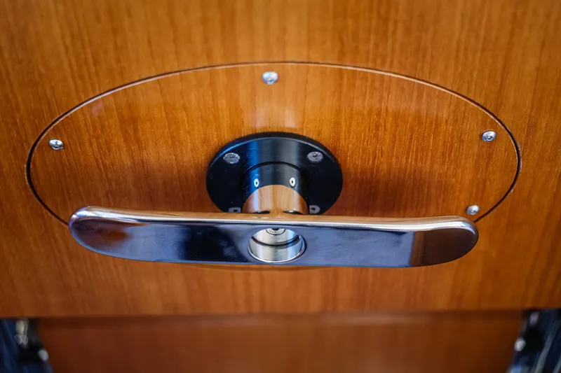 Slide: The Image of Door handle on 2027 Fleming 85 Pilothouse, featuring sleek wood and metal design. - 35