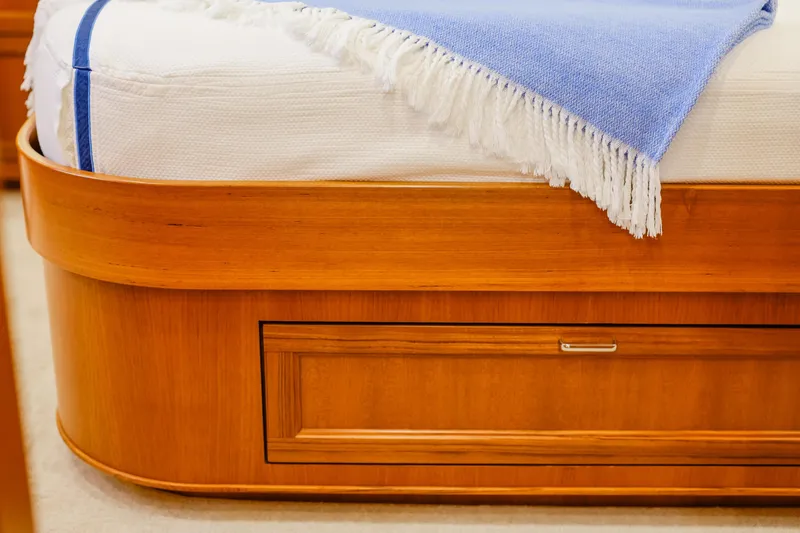 Slide: The Image of Luxurious wooden bed frame with blue blanket on Fleming 85 Pilothouse, 2027 model. - 41