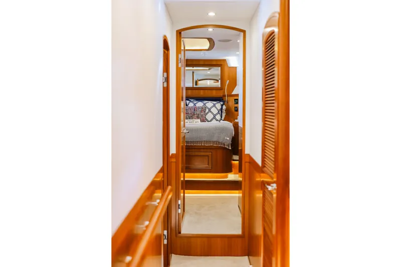 Slide: The Image of Luxurious interior of 2027 Fleming 85 Pilothouse yacht, featuring elegant wood finishes. - 50
