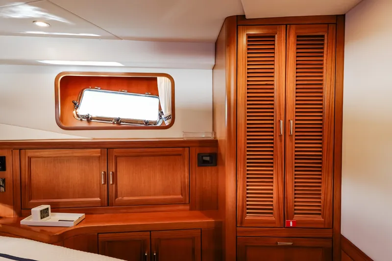 Slide: The Image of Luxurious wood interior of 2027 Fleming 85 Pilothouse yacht cabin. - 52