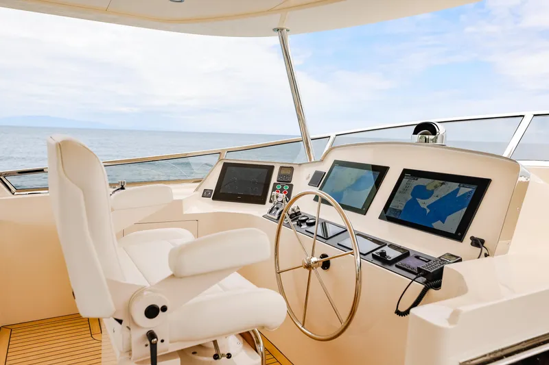 Slide: The Image of Pilothouse of 2027 Fleming 85 yacht with modern navigation equipment and ocean view. - 60