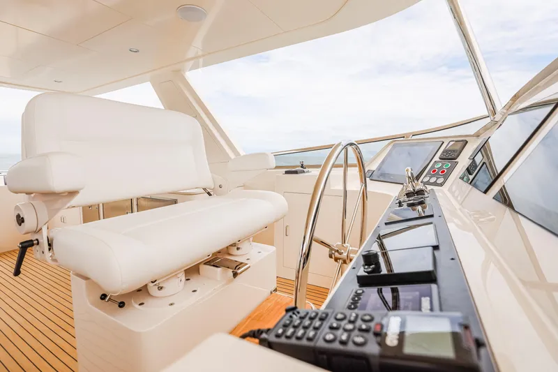 Slide: The Image of Pilothouse interior of 2027 Fleming 85 yacht with modern controls and seating. - 62