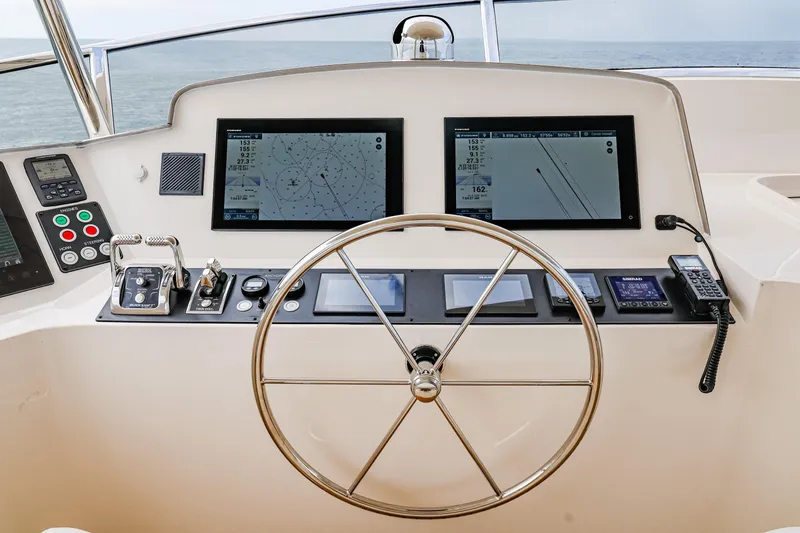 Slide: The Image of Pilothouse of 2027 Fleming 85 yacht with modern navigation displays and controls. - 63