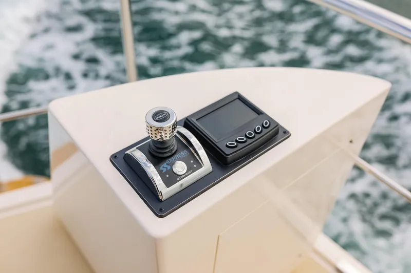 Slide: The Image of Control panel of 2027 Fleming 85 Pilothouse yacht with joystick and display. - 70