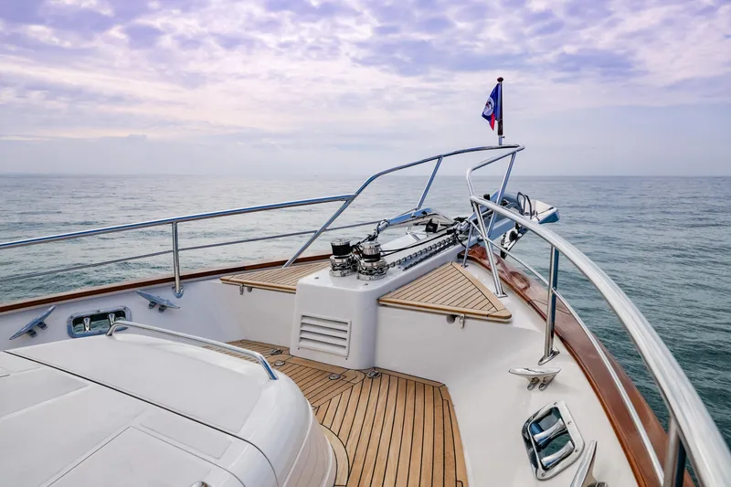 Slide: The Image of Bow view of 2027 Fleming 85 Pilothouse yacht on calm sea under cloudy sky. - 72