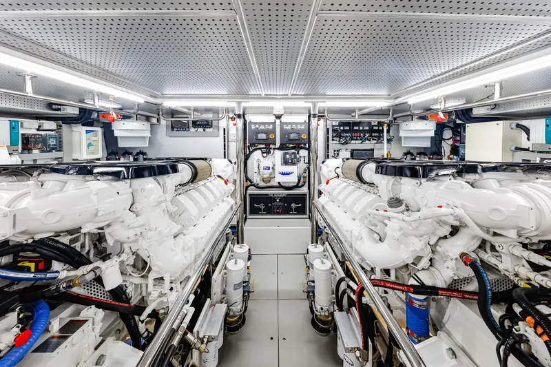 Slide: The Image of Engine room of 2027 Fleming 85 Pilothouse yacht, featuring advanced machinery and equipment. - 82