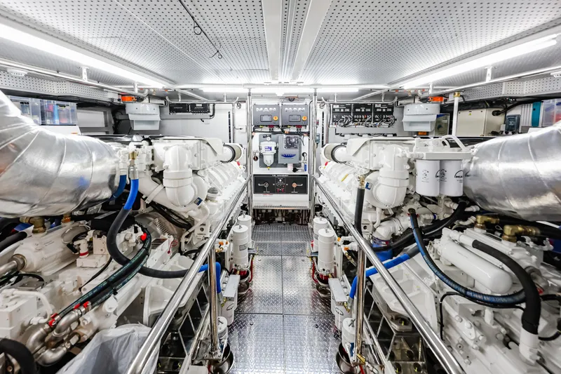 Slide: The Image of Engine room of 2027 Fleming 85 Pilothouse yacht, featuring advanced machinery and controls. - 83