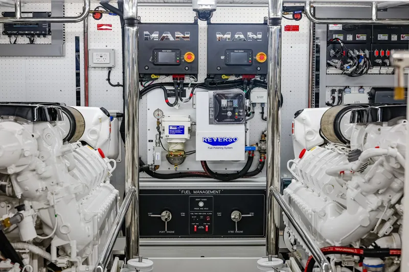Slide: The Image of Engine room of 2027 Fleming 85 Pilothouse yacht with MAN engines and Reverso fuel system. - 84