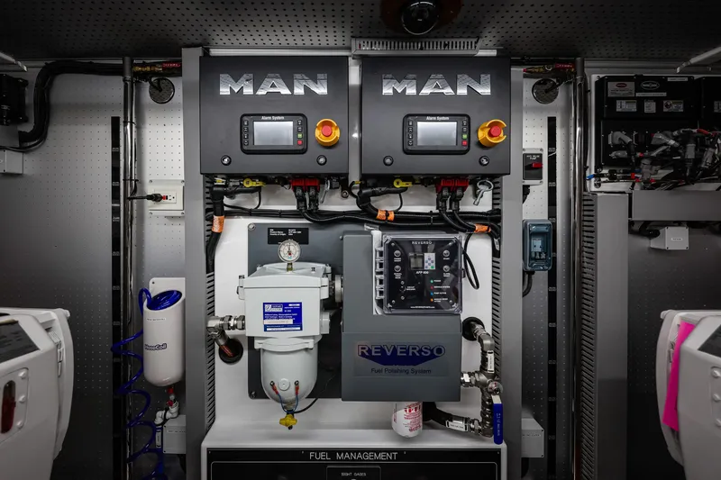 Slide: The Image of Engine room of 2027 Fleming 85 Pilothouse with MAN systems and Reverso fuel management. - 85