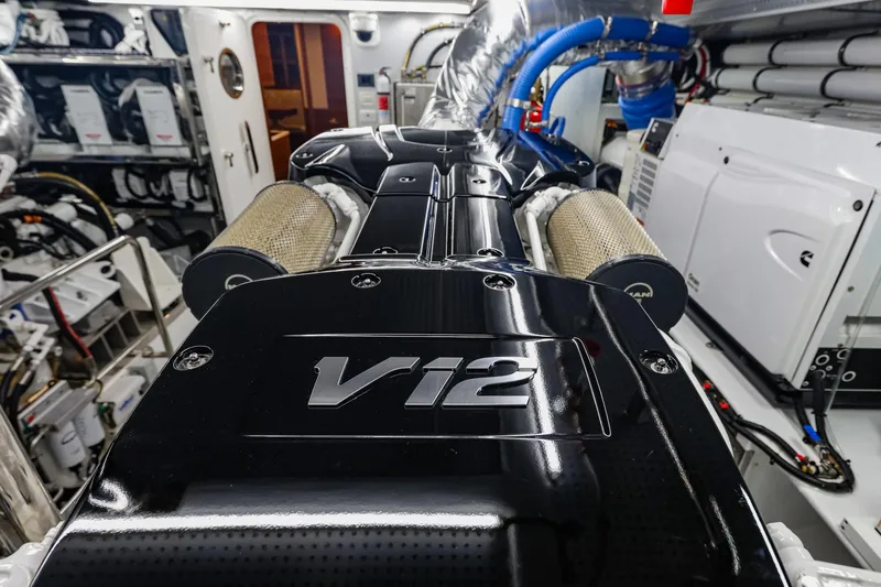 Slide: The Image of Engine room of 2027 Fleming 85 Pilothouse yacht featuring a V12 engine. - 87