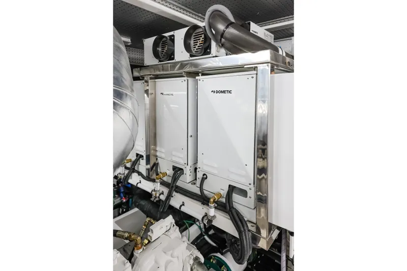 Slide: The Image of Engine room of 2027 Fleming 85 Pilothouse yacht featuring Dometic equipment. - 90