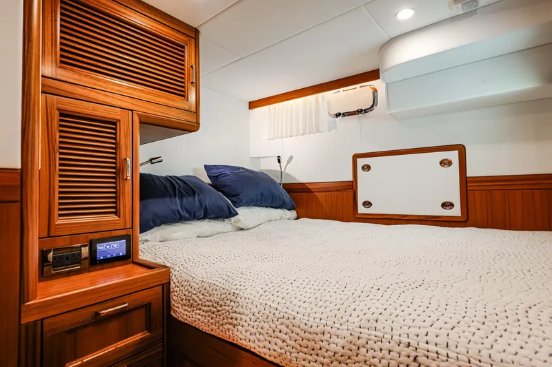 Slide: The Image of Luxurious cabin interior of 2027 Fleming 85 Pilothouse yacht with cozy bedding. - 96