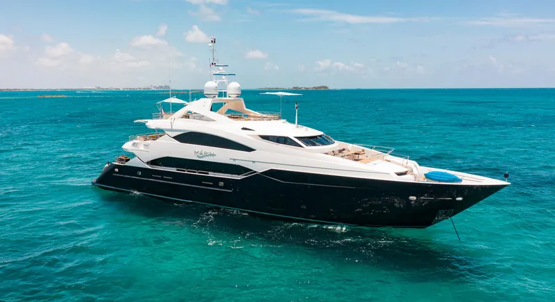Slide: The Image of Luxurious 2014 Sunseeker 131 yacht cruising on the ocean under a partly cloudy sky. - 1